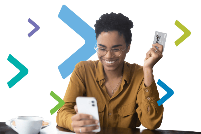 Smiling woman holding an APGFCU Visa Platinum Preferred Credit Card