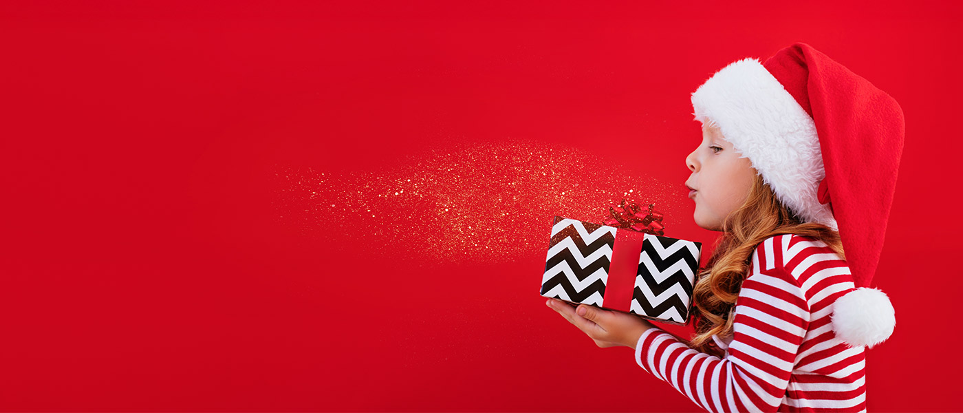 APGFCU Youth Savings Account girl holding a Christmas gift