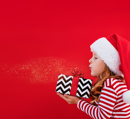 APGFCU Youth Savings Account girl holding a Christmas gift