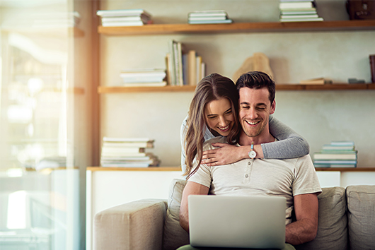Young couple buying first home with an APGFCU Adjustable Rate Mortgage loan.
