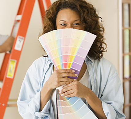 Woman holding paint samples