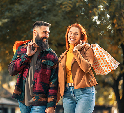 Couple leisure shopping with APGFCU Visa Cash Back Credit Card