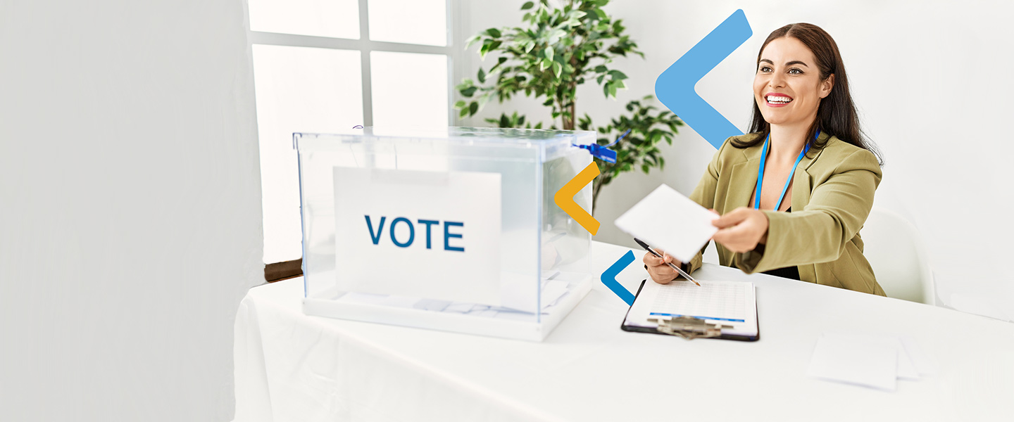 woman handing ballot for voting