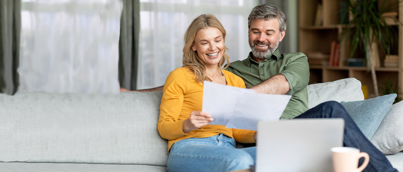 Mature couple opening an APGFCU Money Market Account