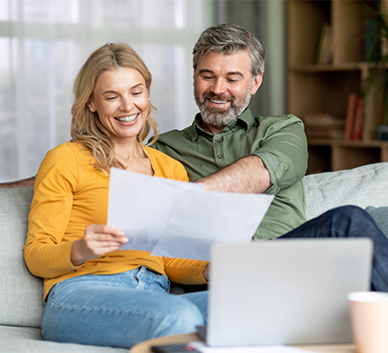 Mature couple opening an APGFCU Money Market Account