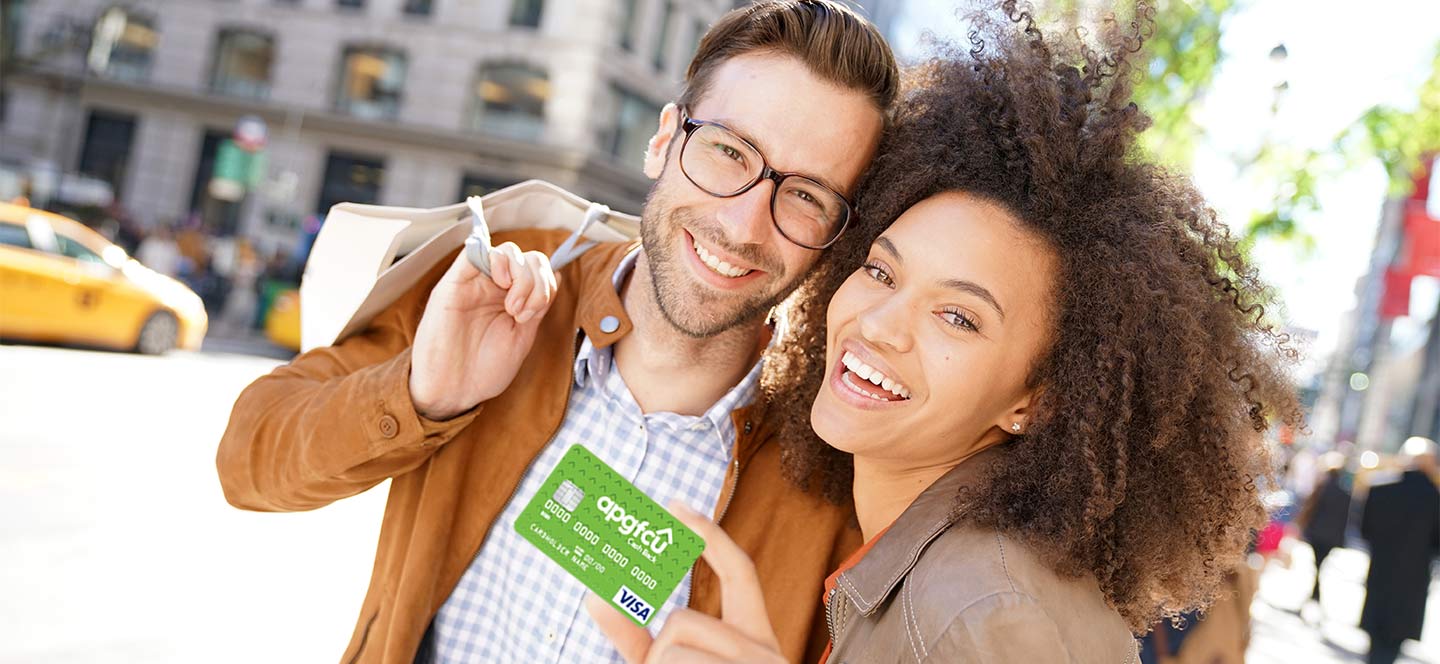 Couple shopping Visa cash back credit card APGFCU