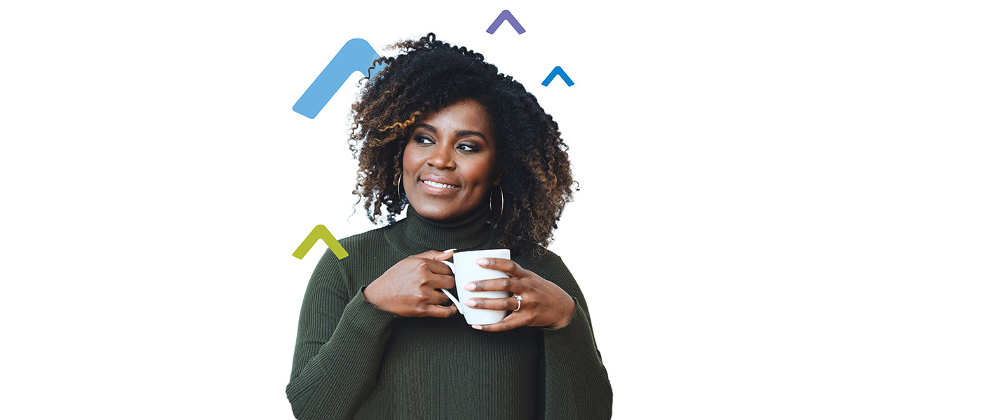 smiling woman holding a coffee cup