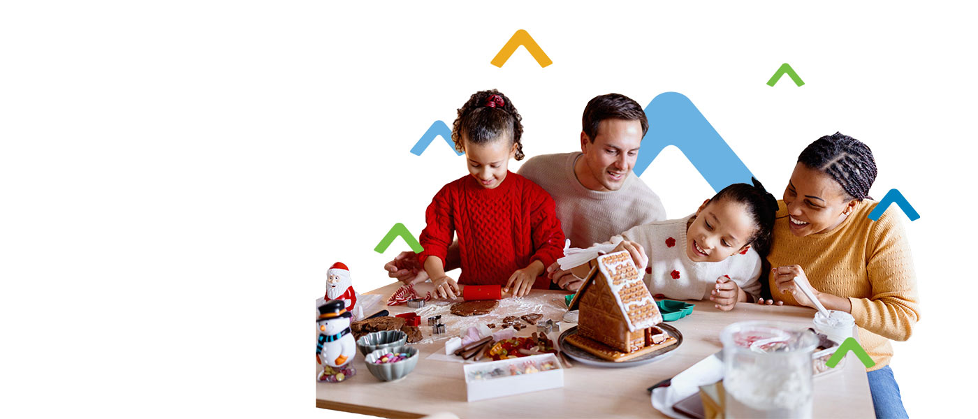 family building a cookie house